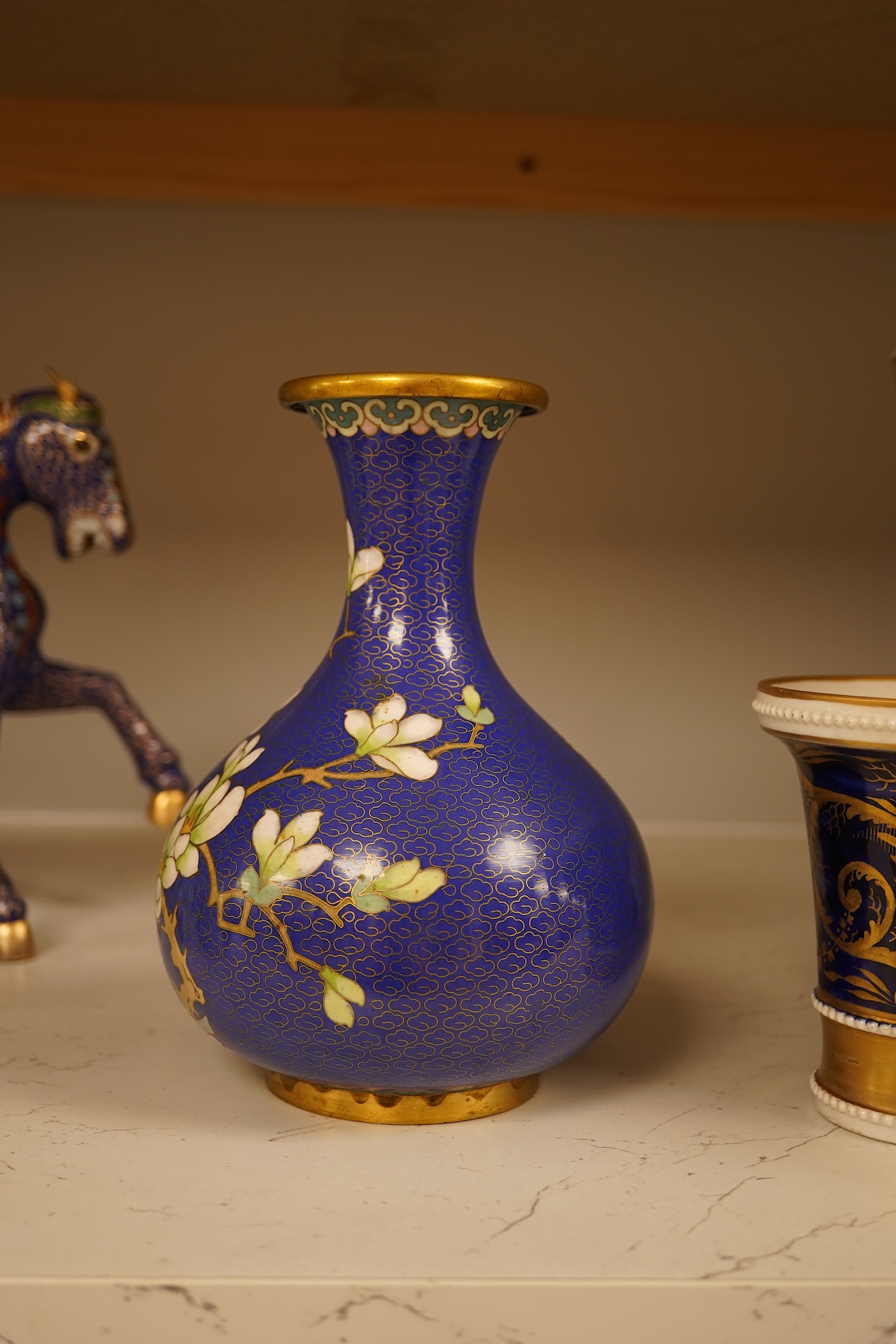 A Chinese cloisonné enamel horse and vase, two miniature Rockingham floral teapots, a malachite box etc (9). Cloisonné horse 20cm long.